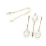 Three Edwardian silver apostle spoons and sugar tongs by Synyer & Beddoes, Birmingham 1903, the