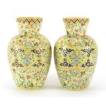Pair of 19th century yellow opaline glass vases, hand painted with stylised flowers and foliage,