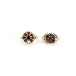Two 9ct gold garnet flower head rings, size O and H, 4.7g :For Further Condition Reports Please