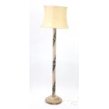 Chinese limed wood standard lamp carved with flowers, having a silk lined shade, overall 187cm