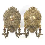 Pair of silver plated two branch wall sconces, decorated with putti and swags, each 36cm high :For