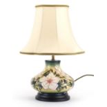 Moorcroft baluster vase lamp base with silk lined shade, hand painted with stylised flowers, overall