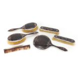 Edwardian silver and tortoiseshell floral pique six piece dressing table set, hand mirror, two pairs