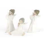 Three Lladro cherubs, the largest 22cm high :For Further Condition Reports Please Visit Our Website.