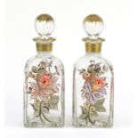 Pair of continental glass decanters, hand painted with flowers :For Further Condition Reports Please