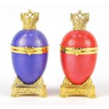 Two Faberge style guilloche enamel egg trinkets on gilt metal stands, each 9cm high :For Further