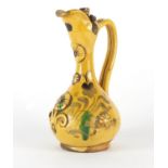 Turkish Canakkale pottery water jug, hand painted and decorated in relief with flowers, 22cm high :