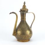 Islamic brass water pot profusely engraved with calligraphy, 34cm high :For Further Condition