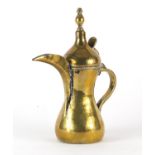 Islamic brass coffee pot, the side with impressed inscription, 25cm high :For Further Condition