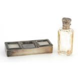 Victorian rectangular silver triple stamp box and a cut glass scent bottle with silver lid, the