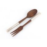 Pair of wooden salad servers with sterling silver handles, by Asprey & Co, 27cm long :For Further