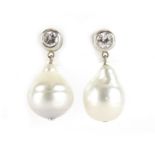 Pair of unmarked white gold pearl and diamond solitaire drop earrings, 3.2cm in length, 16.6g :For