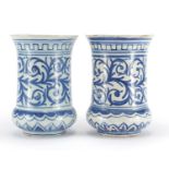 Pair of antique style tin glazed vases, hand painted with foliate motifs, each 25cm high :For