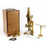 19th century brass microscope by Ross of London, numbered 5219 with lenses and fitted mahogany