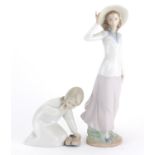 Two Lladro figurines one numbered 5682, the largest 31cm high :For Further Condition Reports