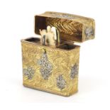 Antique gilt metal necessaire with applied silver floral decoration, the hinged lid opening to