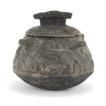 Islamic black stone pot and cover, carved mythical animals, 23cm high :For Further Condition Reports