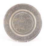 Persian circular silver tray profusely engraved with figures, cattle and birds amongst flowers,