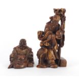 Two Chinese russet soapstone carvings including one of an elder, character marks to the base, the