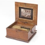 19th century walnut polyphone by Schutz, the hinged lid with floral marquetry inlay, 22cm H x 54cm W