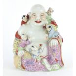 Chinese porcelain happy Buddha with five children, hand painted in the famille rose palette,