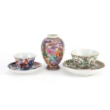 Chinese porcelain including a Cantonese tea bowl with saucer and a mandarin palette vase, the
