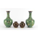 Pair of Chinese cloisonné vases, enamelled with flowers and a smaller pair of jars and covers, the