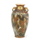 Japanese Satsuma pottery vase with twin handles, hand painted with immortals and dragons,