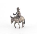 Good quality unmarked silver model of a Dutch girl on a donkey, 5cm high, 57.6g :For Further