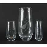 Three Orrefors glass vases including a large example etched with a mandolin, one with paper label,
