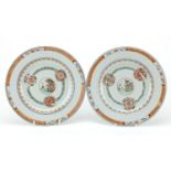 Pair of Chinese porcelain plates, each hand painted with a central roundel enclosing a landscape
