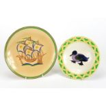 Two Ashtead pottery plates including one hand painted with a duck, each with factory marks to the