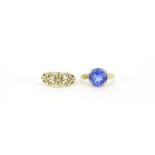 9ct gold blue stone solitaire ring, size N and a 9ct gold floral ring, size M, 5.0g :For Further