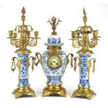 Chinese blue and white porcelain three piece clock garniture with gilt metal mounts, each hand