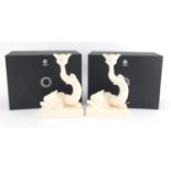 Pair of Wedgwood and Bentley cream ware dolphin candlesticks with boxes, each 25cm high :For Further