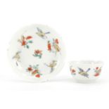 Chinese porcelain tea bowl and saucer, hand painted with birds of paradise and insects, the saucer