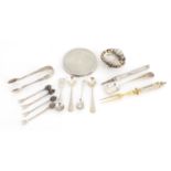 Mostly silver objects including a circular compact, shell shaped salt, mustard spoons and sugar