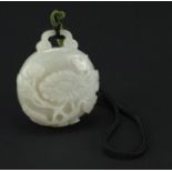 Chinese white jade belt hook, finely carved with flowers, 6cm high :For Further Condition Reports