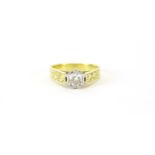 18ct gold diamond solitaire ring, the shoulders engraved with flowers, size O, 5.5g :For Further