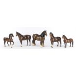 Five Beswick brown horses including a shire and Dartmoor pony, the largest 21cm high :For Further