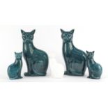 Five Poole pottery cats including a white glazed example, the largest each 29.5cm high :For
