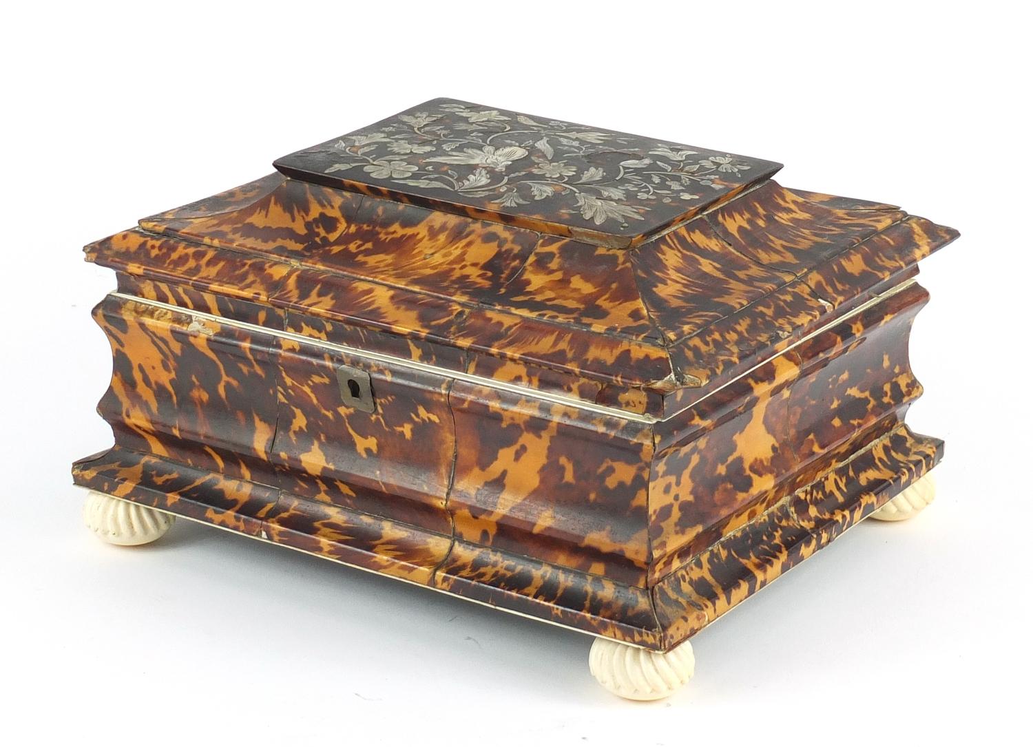 19th century tortoiseshell and ivory sewing box, the hinged lid with mother of pearl floral inlay,