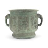 Chinese archaic style patinated bronze planter with elephant head handles, cast with panels of birds