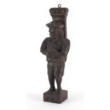 Antique Continental wood carving of a peasant wearing a hat and carrying a bowl, 31.5cm high :For