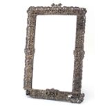 Large Victorian silver easel mirror, pierced and embossed with putti amongst flowers, by Rosenthal