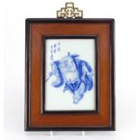 Chinese porcelain plaque hand painted with a Lohan, with calligraphy, housed in a hardwood frame,