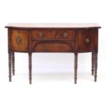 Regency mahogany six legged sideboard with line inlay, two central doors and two drawers, one with