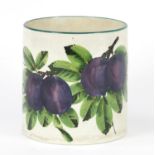 Wemyss Ware cylindrical pot, hand painted with plums, painted and impressed marks to the base,