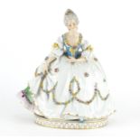 Austrian porcelain figurine of a female wearing a dress, hand painted with flowers, factory marks