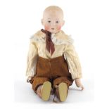 German bisque headed doll of a boy, 35cm in length :For Further Condition Reports Please Visit Our